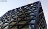 The Four New Bailey building in Manchester capturing a reflection of the Affinity Living tower block.