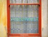 An old window advertising a chiropody business on Yorkshire Street in Morecambe, Lancashire.
