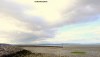 A dramatic plume of cloud settles over the South Beach of Morecambe in Lancashire, UK.